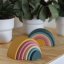 PETITE&MARS Silicone folding toy Rainbow Intense Ocher 12m+