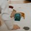 PETITE&MARS Silicone folding toy Rainbow Intense Ocher 12m+